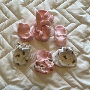 Six assorted infant booties and handmitts